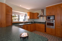 Full kitchen has everything you need, including, gas hob, wall oven, microwave and dishwasher.